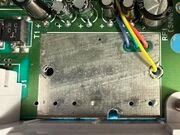 Fig. 3. The unused vias for an RF modulator are repurposed in this install to route the RGBS wires to the underside of the board.